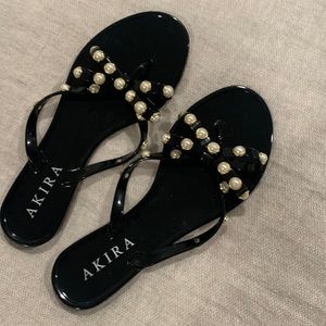 black sandals with pearl and gold details